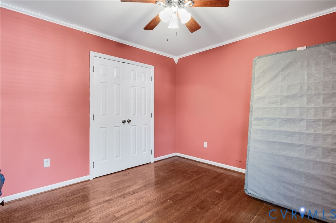 8994 Becton Road Glen Allen, VA 23060 - Photo 24 of 29 Unfurnished bedroom with crown molding, dark wood-