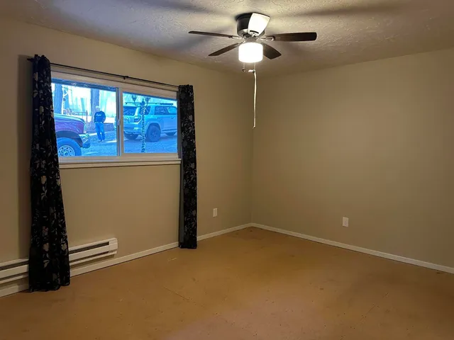 a room with furniture and a large window