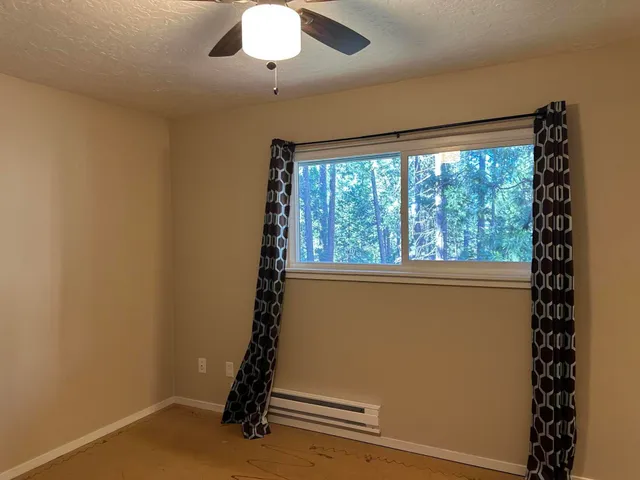 a view of street with parked cars