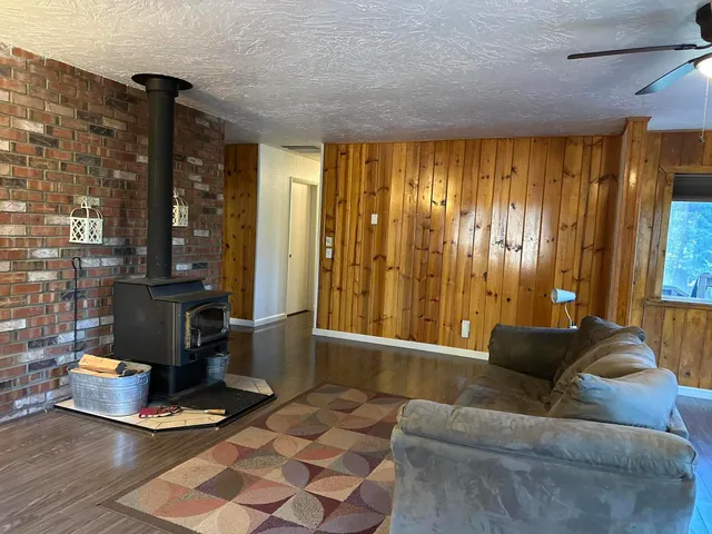 an empty room with closet and entryway