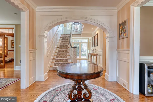 a dining room with furniture and chandelier