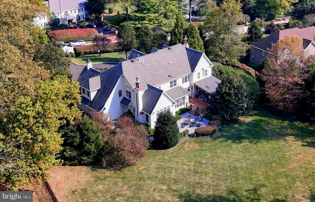 a view of swimming pool with a patio and fire pit