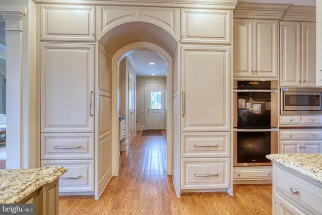 a bathroom with a toilet and a mirror