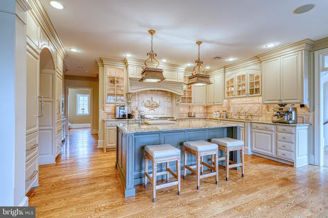 a kitchen with a sink and chair