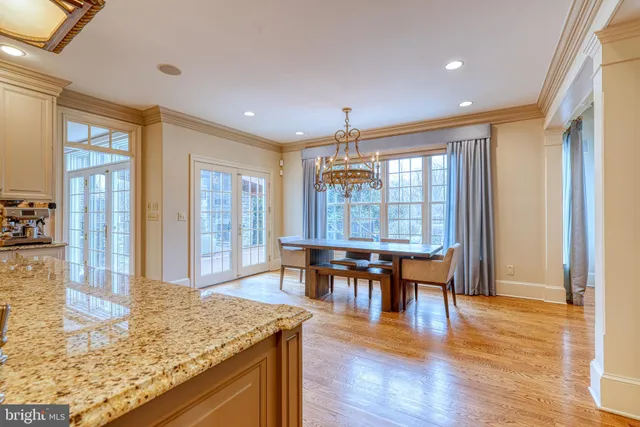 a view of a hallway with a livingroom and a bathroom