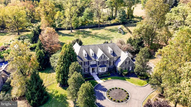 an aerial view of a house with outdoor space swimming pool and lake view