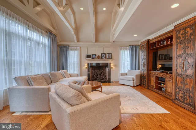 a spacious bathroom with a granite countertop sink mirror and a bathtub