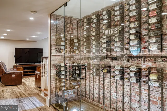 a living room with furniture gym equipment and a baby crib