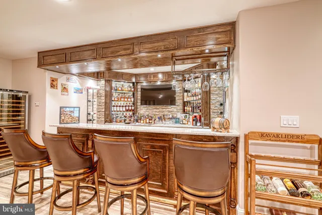 a living room with furniture and a gym equipment