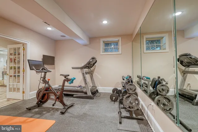 a view of a kitchen with fridge and staircase