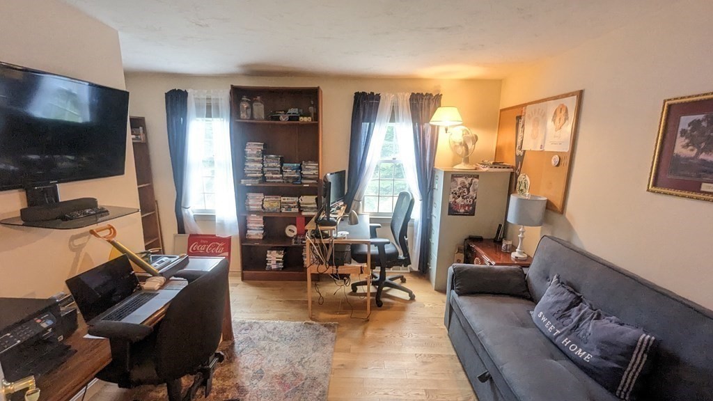 10 Van Gemert Drive Mansfield, MA 02048 - Photo 14 of 33 a living room with furniture and a flat screen tv