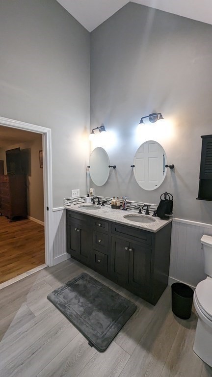 10 Van Gemert Drive Mansfield, MA 02048 - Photo 21 of 33 a spacious bathroom with a granite countertop sink a mirror and a toilet