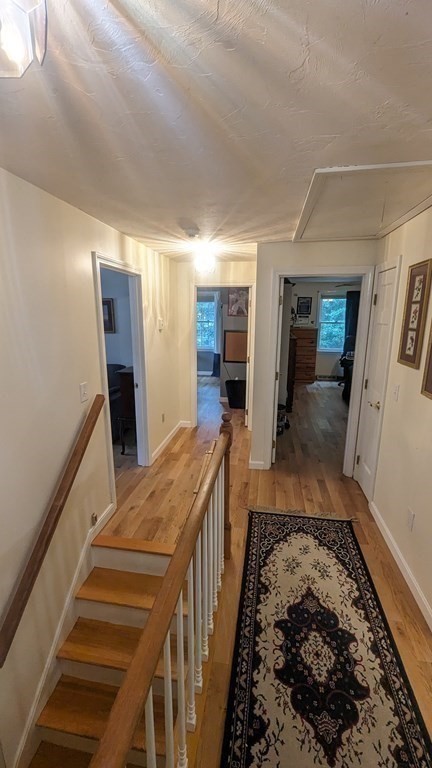 10 Van Gemert Drive Mansfield, MA 02048 - Photo 24 of 33 a bathroom with a sink and mirror with bathtub