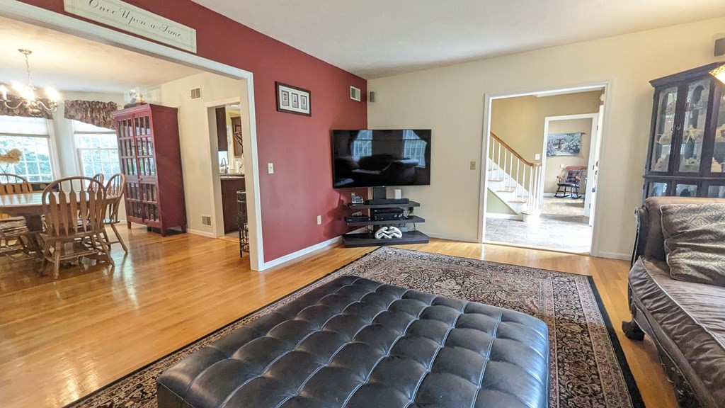 10 Van Gemert Drive Mansfield, MA 02048 - Photo 6 of 33 a living room with furniture and a flat screen tv