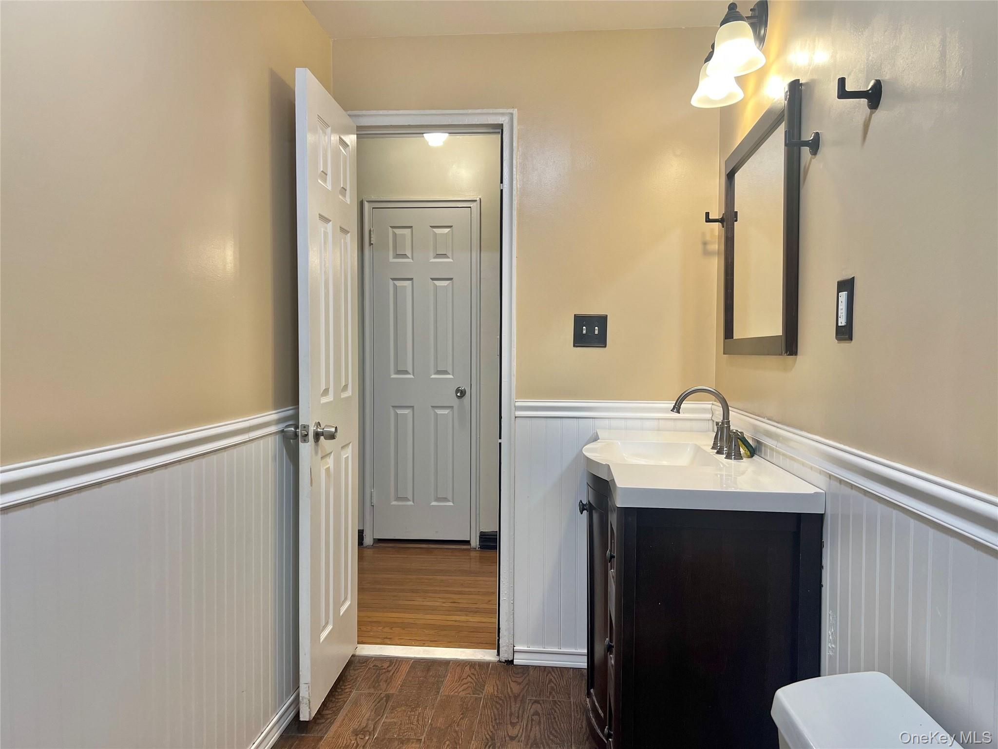 96-11 65th Road, Unit 1 Queens, NY 11374 - Photo 6 of 10 a bathroom with a sink and a mirror