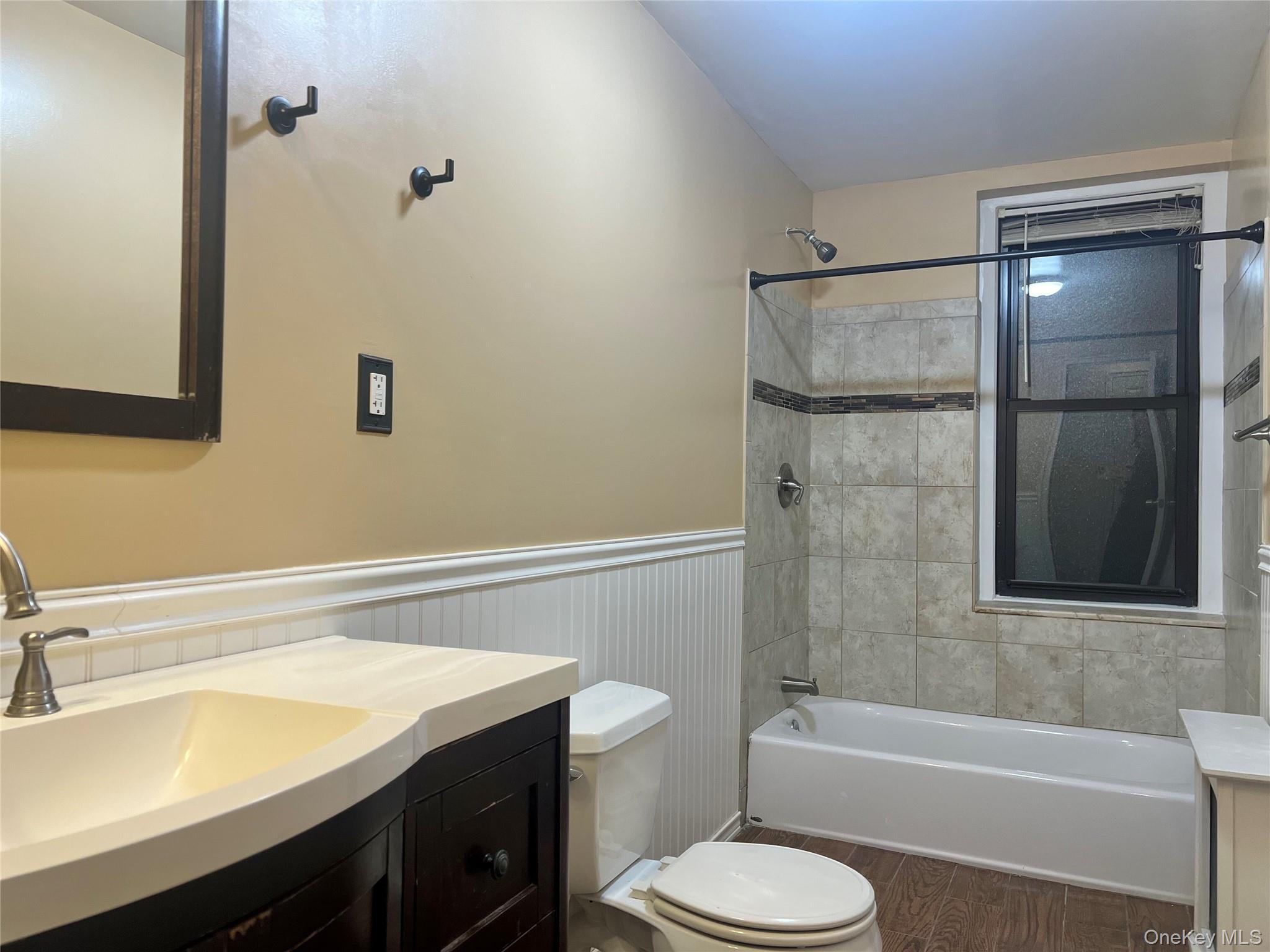 96-11 65th Road, Unit 1 Queens, NY 11374 - Photo 7 of 10 a bathroom with a sink toilet and shower