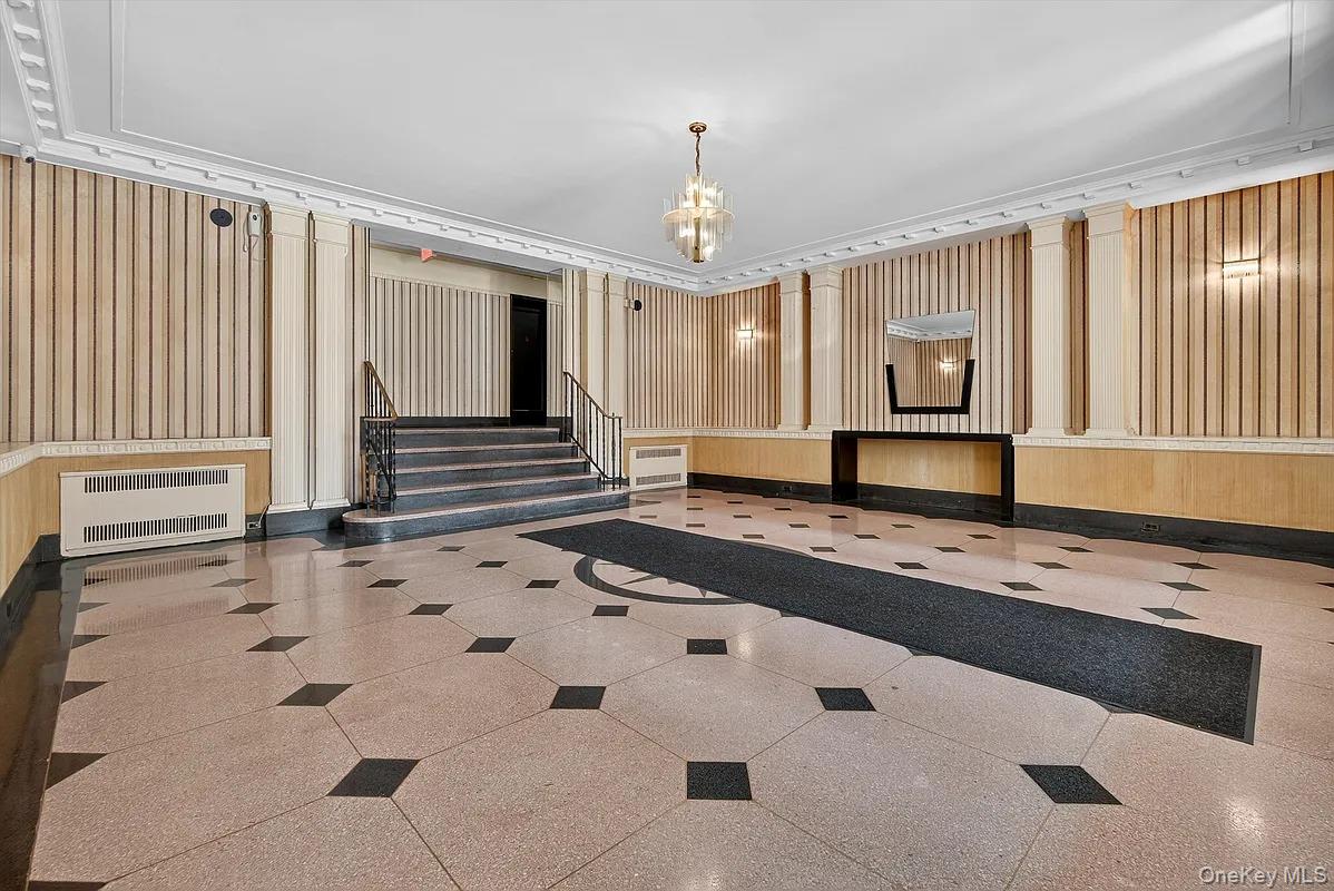 96-11 65th Road, Unit 1 Queens, NY 11374 - Photo 10 of 10 a hallway with white cabinets and window