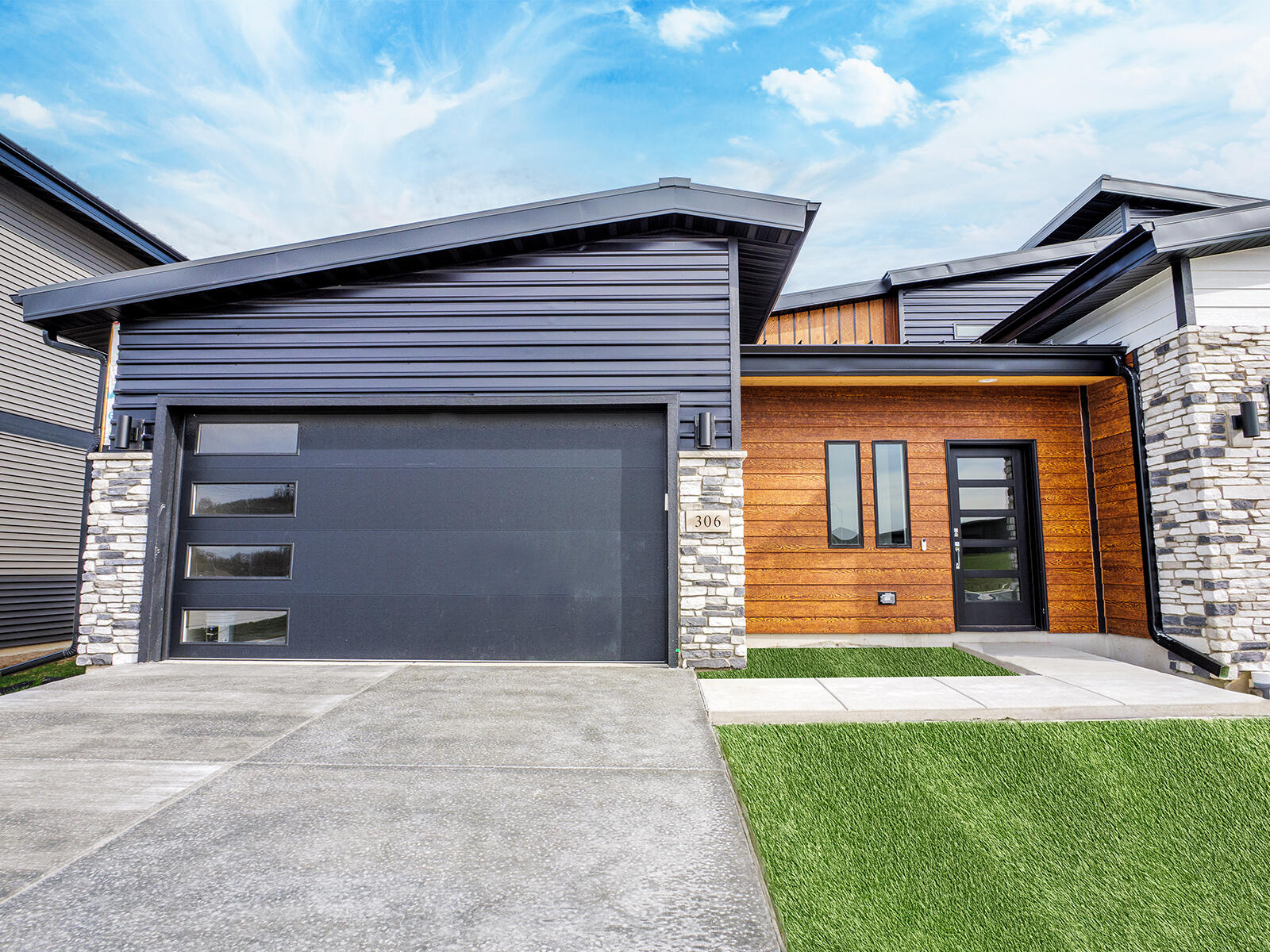 a view of a house with a yard and garage