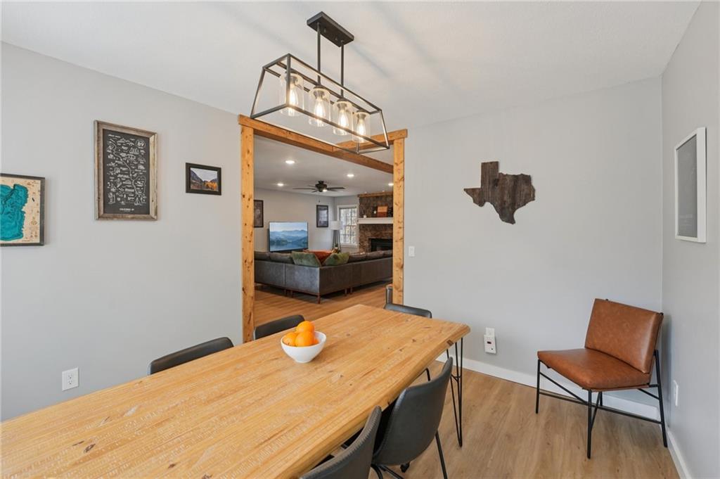 1600 Mountain Trace Canton, GA 30114 - Photo 13 of 50 a view of a dining room with furniture and wooden floor