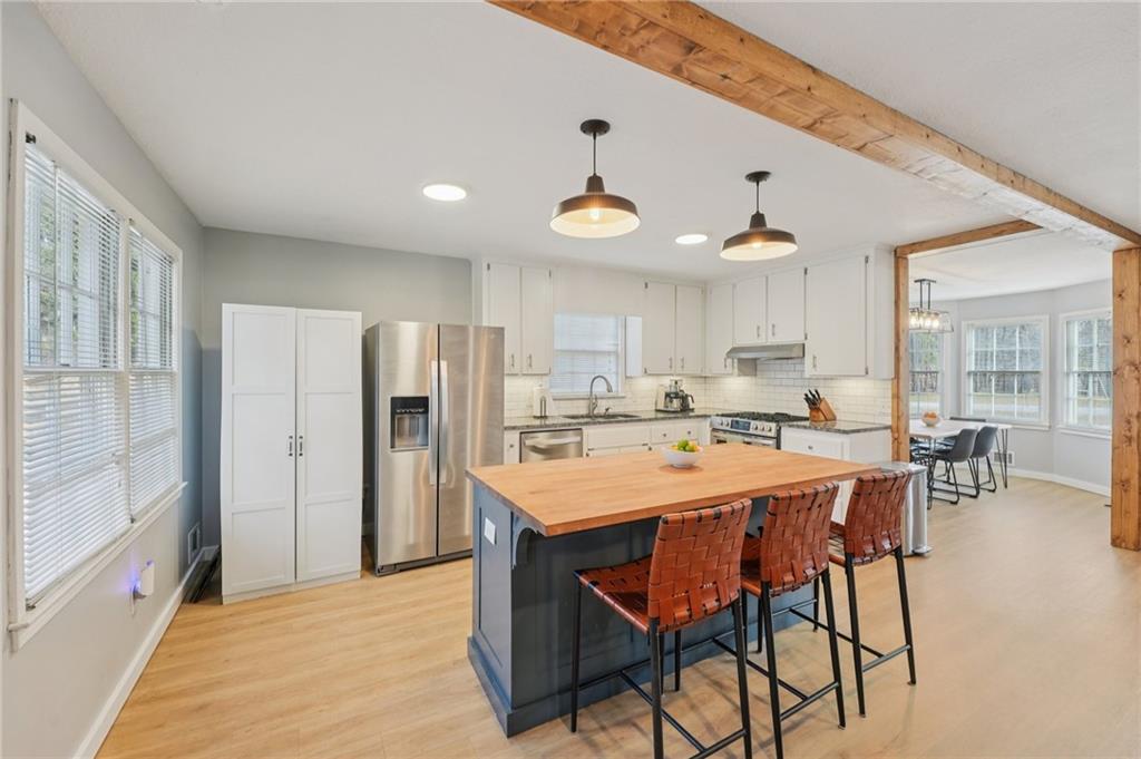1600 Mountain Trace Canton, GA 30114 - Photo 14 of 50 a large kitchen with a table and chairs