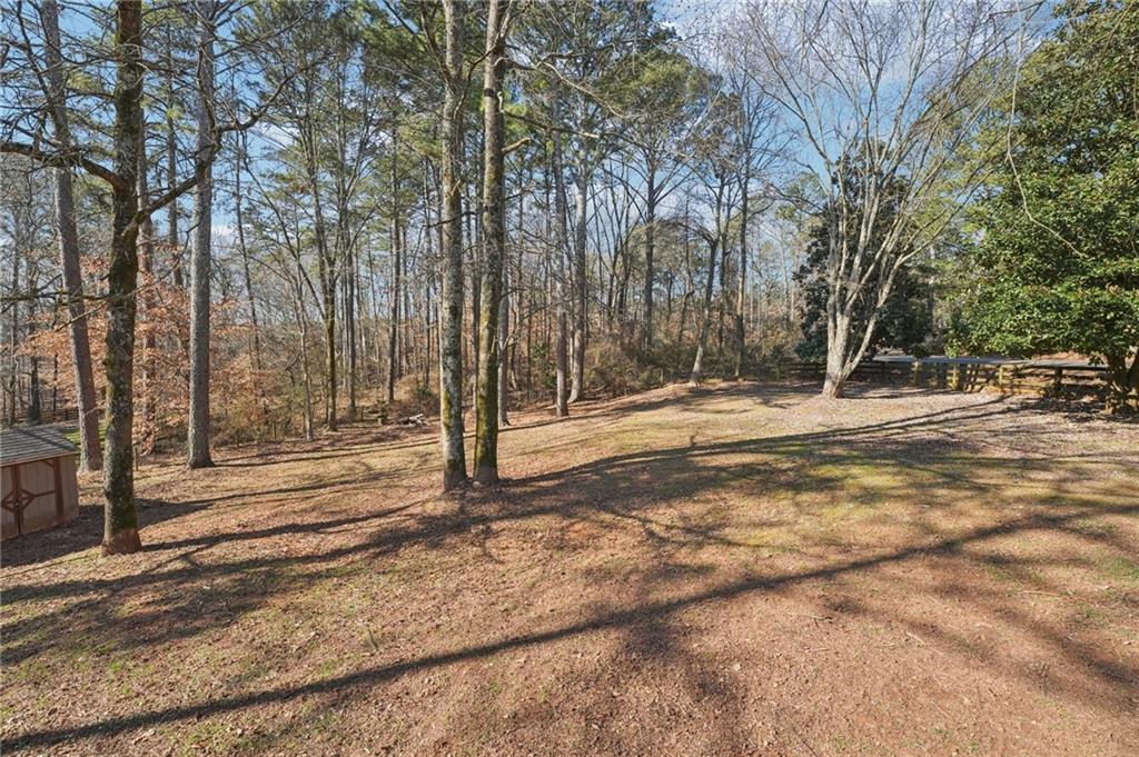 1600 Mountain Trace Canton, GA 30114 - Photo 34 of 50 a backyard of a house with lots of green space