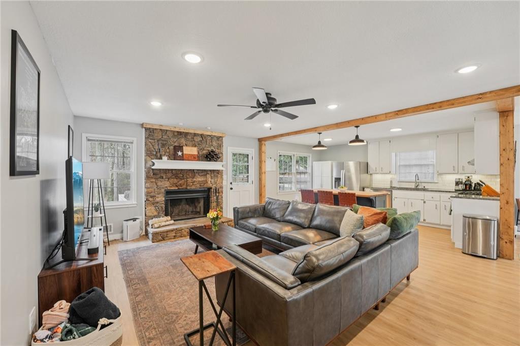 1600 Mountain Trace Canton, GA 30114 - Photo 5 of 50 a living room with furniture a fireplace and a kitchen view