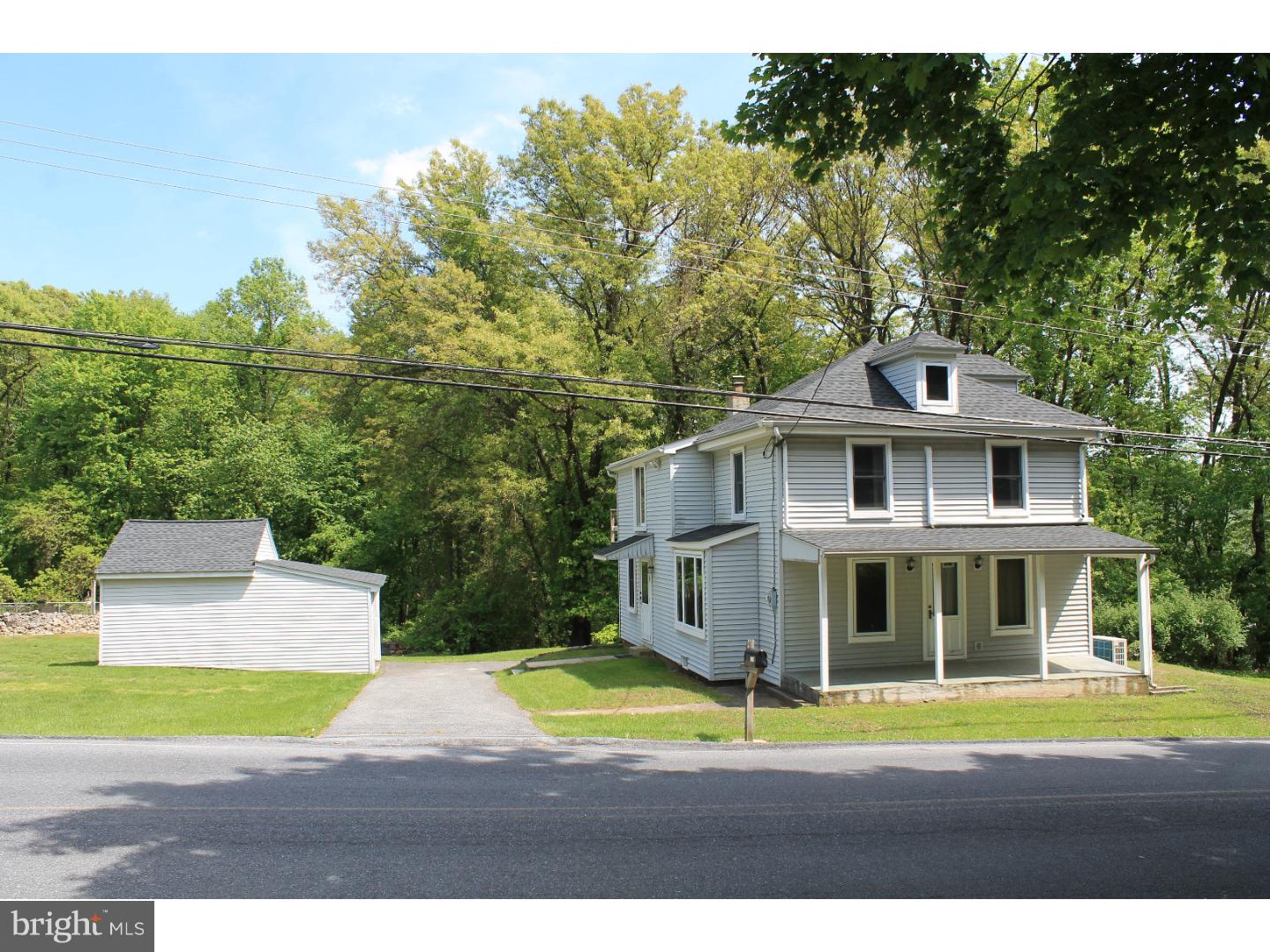 1724 Ramich Road Temple, PA 19560 - Photo 1 of 25 a front view of a house with a yard