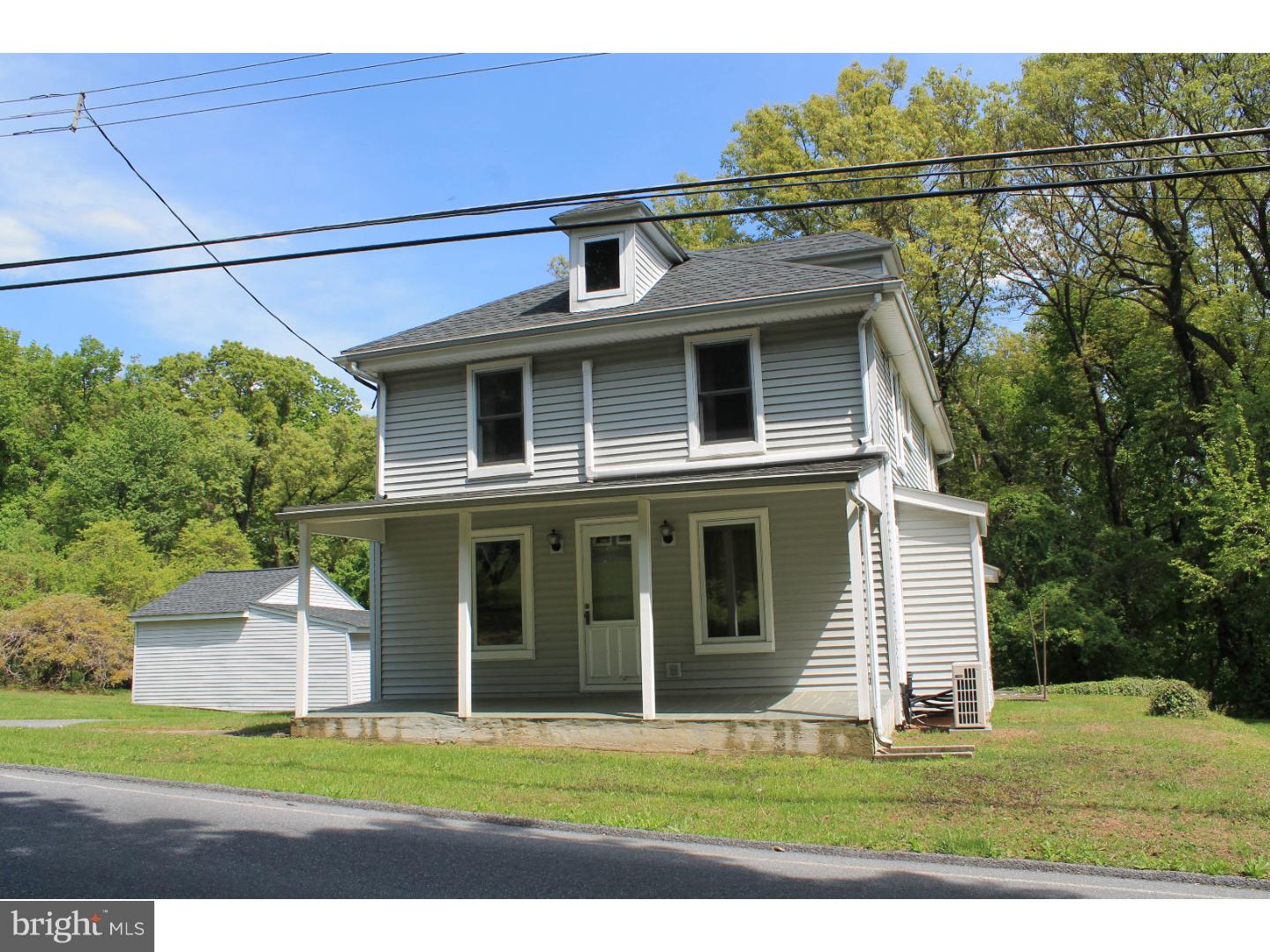 1724 Ramich Road Temple, PA 19560 - Photo 2 of 25 a front view of a house with a yard