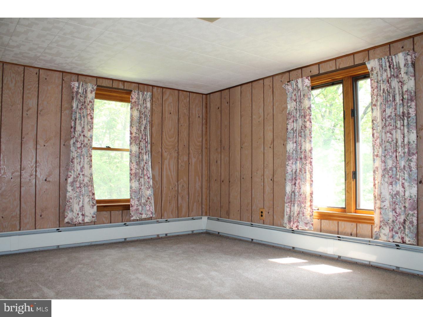 1724 Ramich Road Temple, PA 19560 - Photo 17 of 25 an empty room with large windows