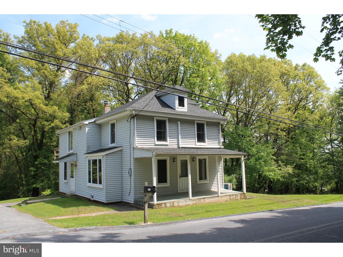 1724 Ramich Road Temple, PA 19560 - Photo 21 of 25 a front view of a house with a garden
