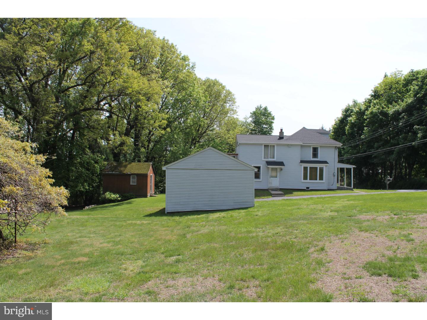 1724 Ramich Road Temple, PA 19560 - Photo 25 of 25 a house that is sitting in the grass with large trees
