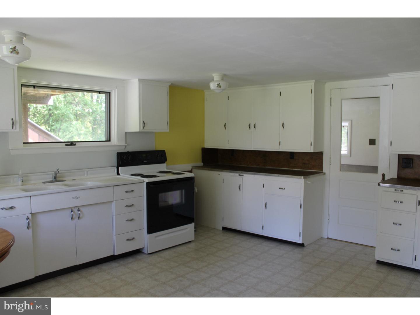 1724 Ramich Road Temple, PA 19560 - Photo 7 of 25 a kitchen with cabinets appliances and a window