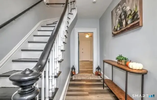 a view of entryway with wooden floor