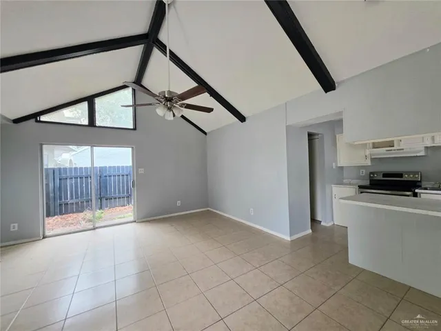 a view of an empty room and a window