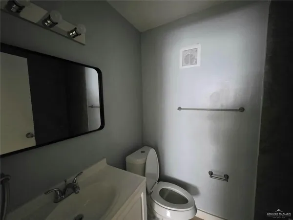 a bathroom with a sink and toilet