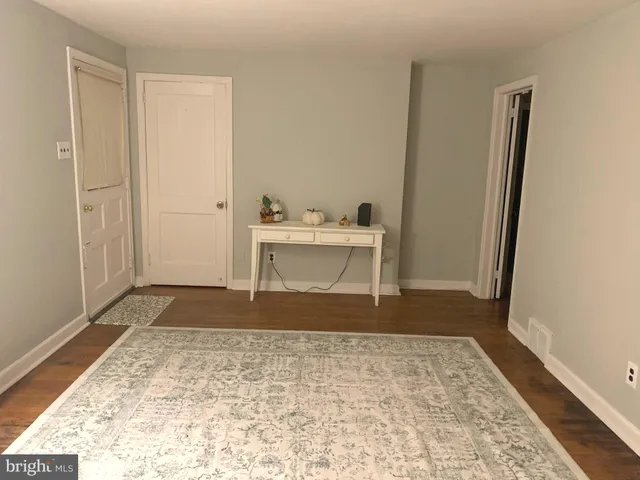a view of a room with a sink and a bath tub