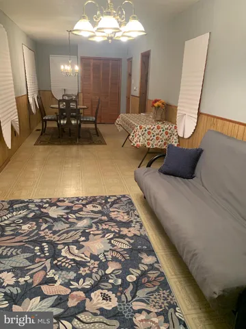 a bedroom with furniture and wooden floor