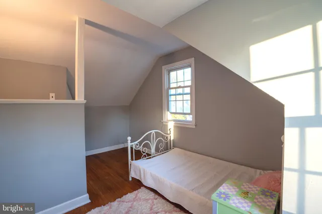 a bed room with a bed and a window