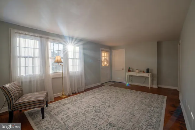 a view of a livingroom with furniture and windows