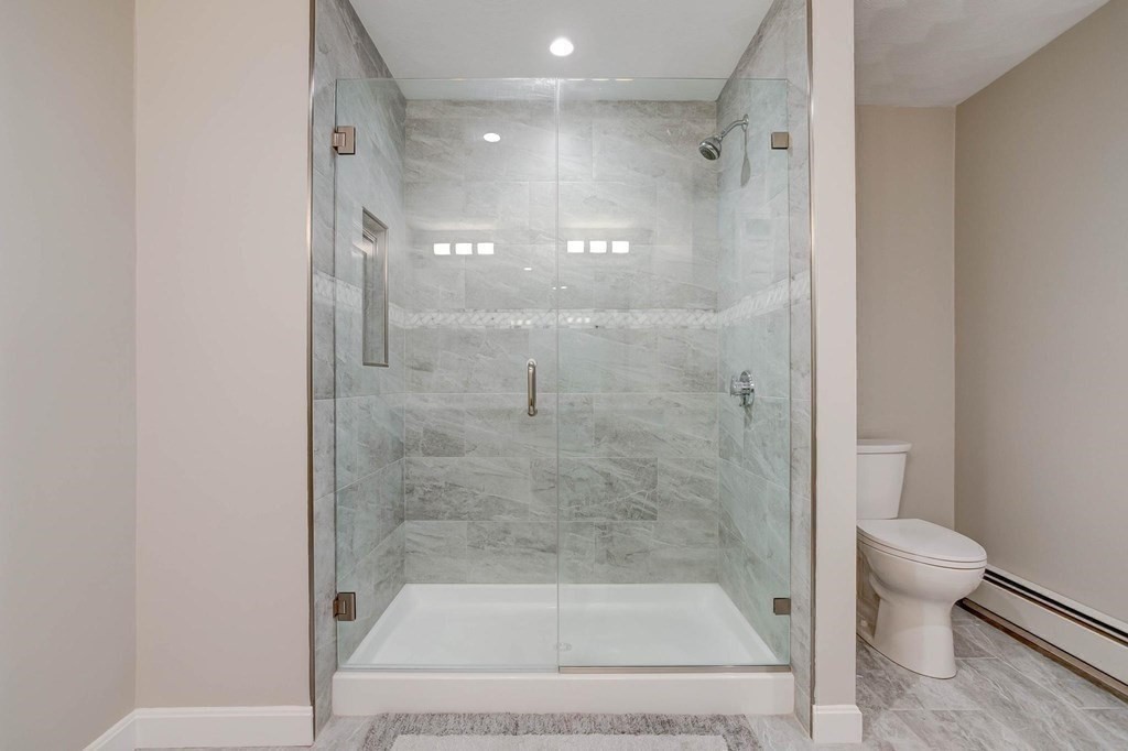 36 Rainbow Circle Peabody, MA 01960 - Photo 11 of 41 a bathroom with a shower a toilet and a sink