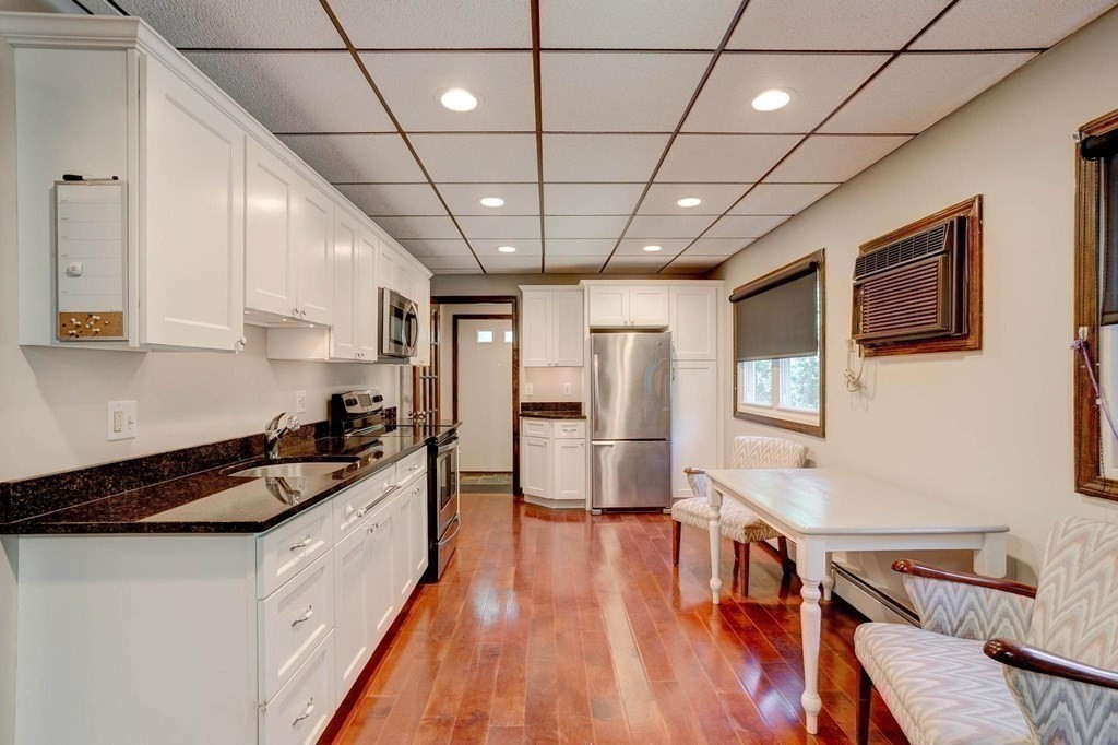 36 Rainbow Circle Peabody, MA 01960 - Photo 17 of 41 a large white kitchen with sink stove and refrigerator