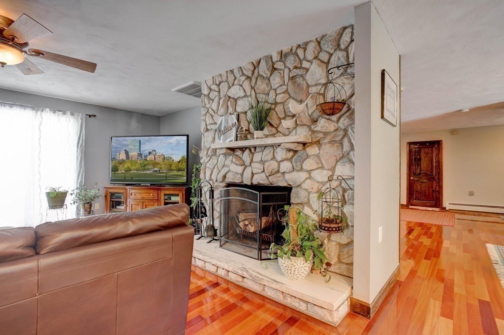 36 Rainbow Circle Peabody, MA 01960 - Photo 2 of 41 a living room with furniture and a fireplace