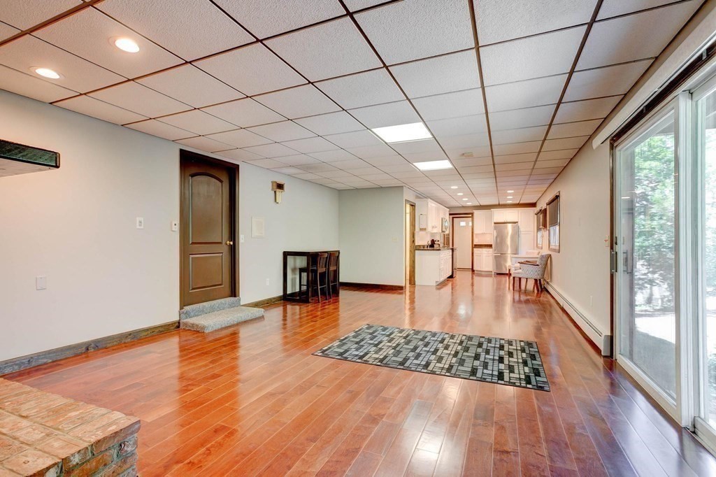 36 Rainbow Circle Peabody, MA 01960 - Photo 26 of 41 a view of livingroom with furniture wooden floor and window