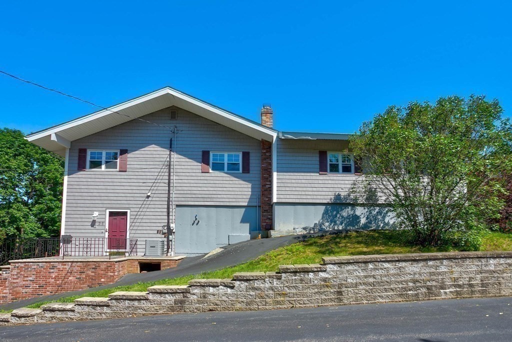 36 Rainbow Circle Peabody, MA 01960 - Photo 37 of 41 a front view of a house with a yard
