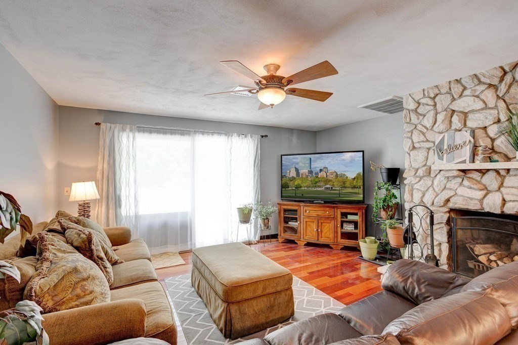 36 Rainbow Circle Peabody, MA 01960 - Photo 5 of 41 a living room with furniture and a flat screen tv