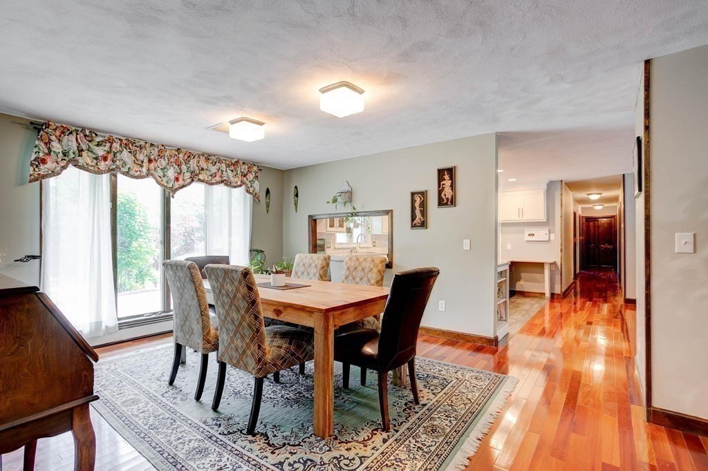36 Rainbow Circle Peabody, MA 01960 - Photo 8 of 41 a view of a dining room with furniture window and wooden floor