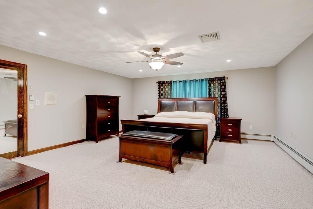 36 Rainbow Circle Peabody, MA 01960 - Photo 9 of 41 a bedroom with furniture and a ceiling fan