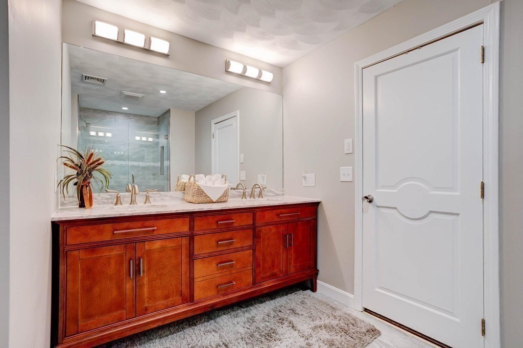 36 Rainbow Circle Peabody, MA 01960 - Photo 10 of 41 a bathroom with a double vanity sink and mirror