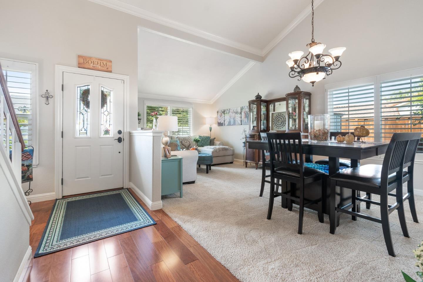 42 Seneca Lane San Ramon, CA 94583 - Photo 3 of 40 a view of a dining room with furniture and a chandelier