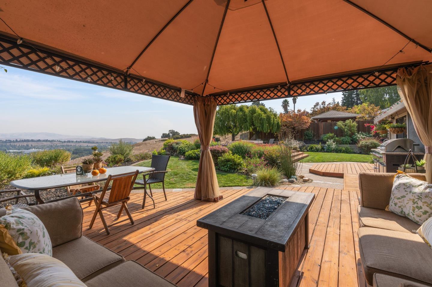 42 Seneca Lane San Ramon, CA 94583 - Photo 31 of 40 a view of a patio with couches under an umbrella
